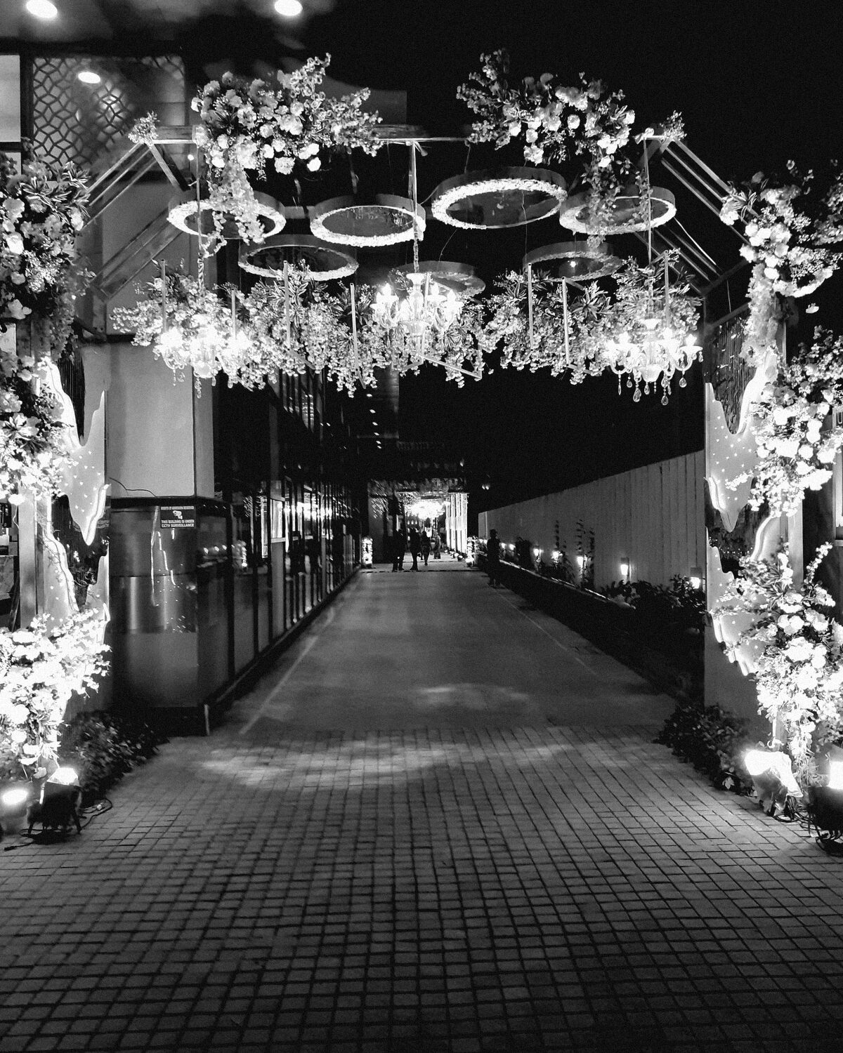 An arched colonnade lit for an evening reception