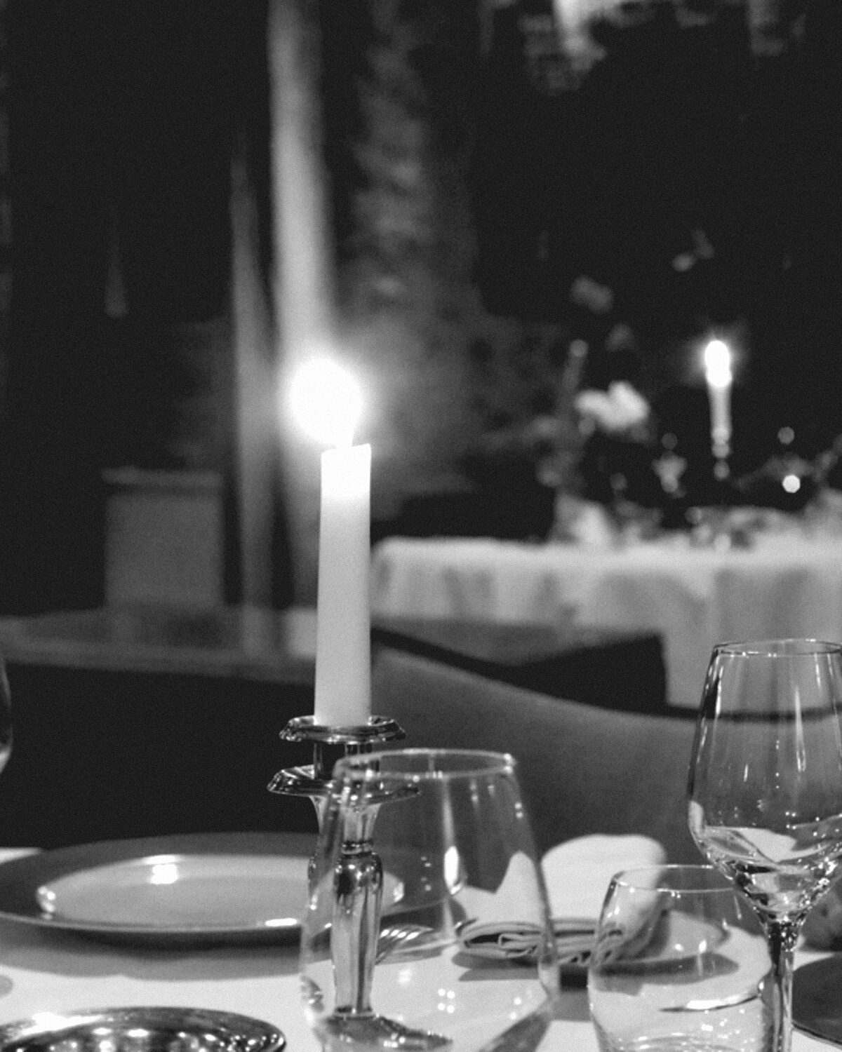 A long dinner table set for a reception